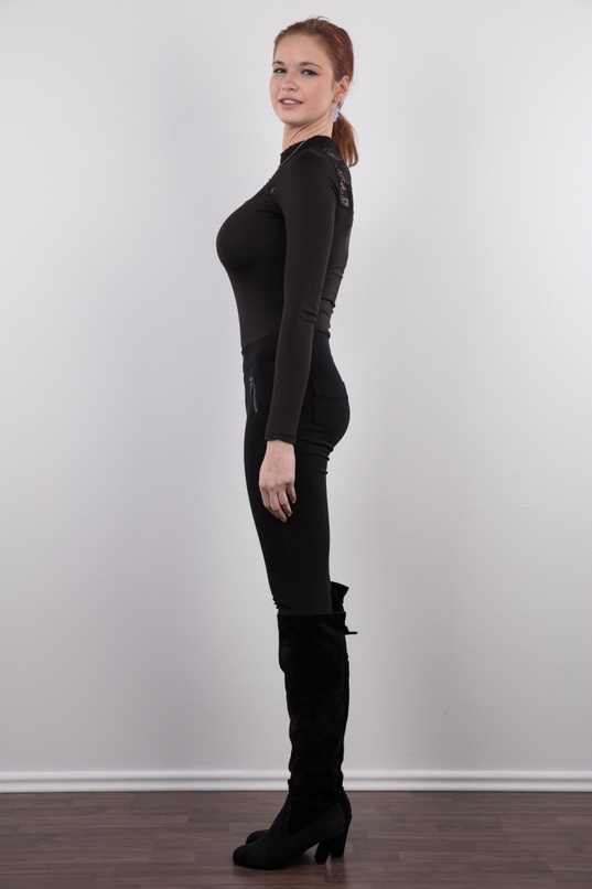 redhead,big tits,big boobs,slim body,white skin,black bodysuit,thigh high boots,over the knee boots,heels,tight clothes,amateur,standing pose,profile view