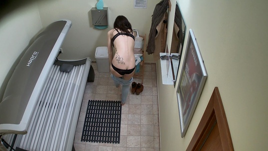 2. Download full pics of Young Brunette Exposes Everything in Solarium from czechsolarium.com