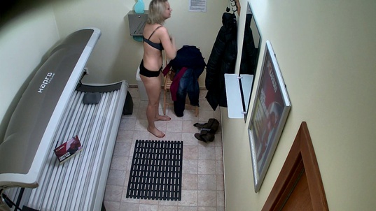 2. Download full pics of Blonde Strips Again in Solarium from czechsolarium.com