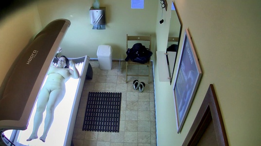 6. Download full pics of MILF With Huge Tits Strips Down in Solarium from czechsolarium.com