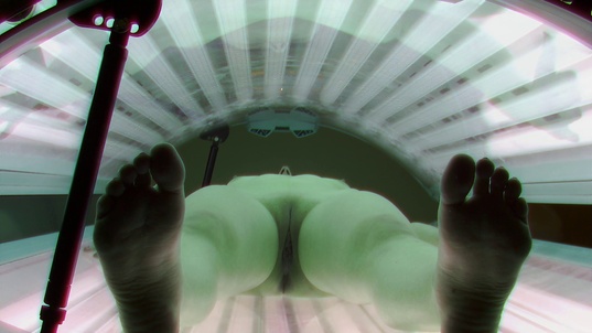 4. Download full pics of Brunette's Tan Lines Caught on Camera from czechsolarium.com