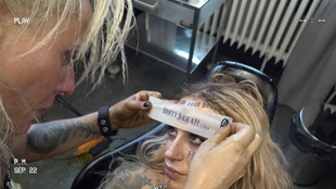 1. Download full pics of Forehead Tattoo from dirtysarah.com