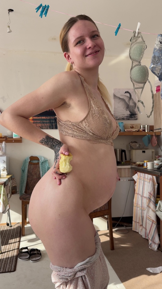 snack in hand, belly stealing lunch 🤰
